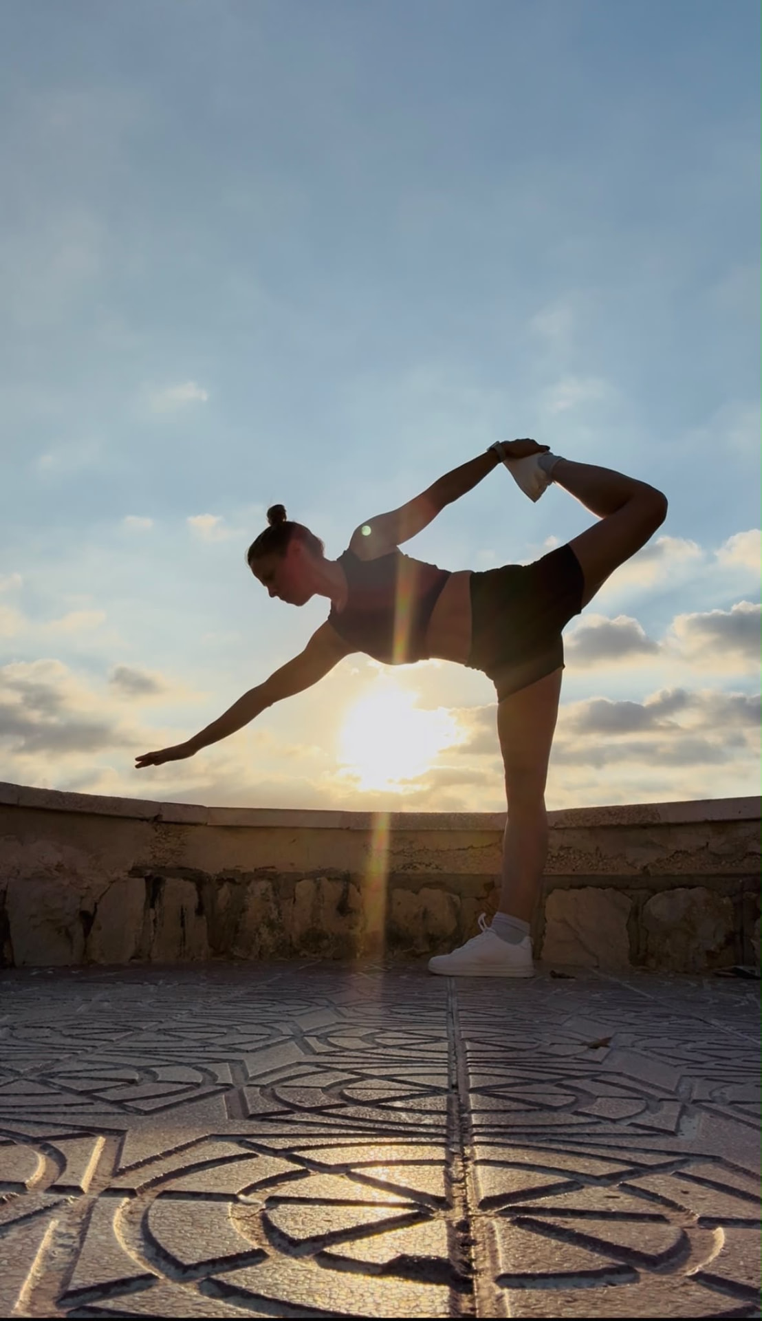Celene in a standing balance at sunset
